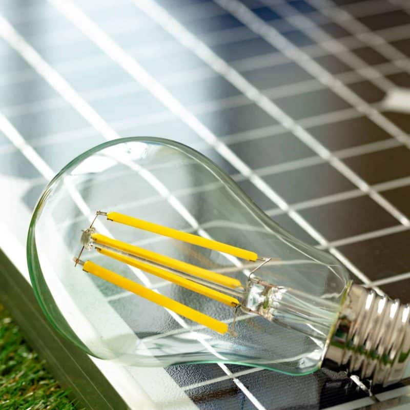 Solar energy panel and light bulb, green energy concept